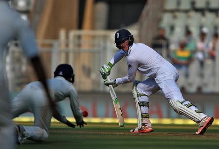 Cricket - India v England - Fourth Test cricket match - Wankhede Stadium, Mumbai, India - 8/12/16. England's Keaton Jennings (R) is caught by India's Cheteshwar Pujara. REUTERS/Danish Siddiqui