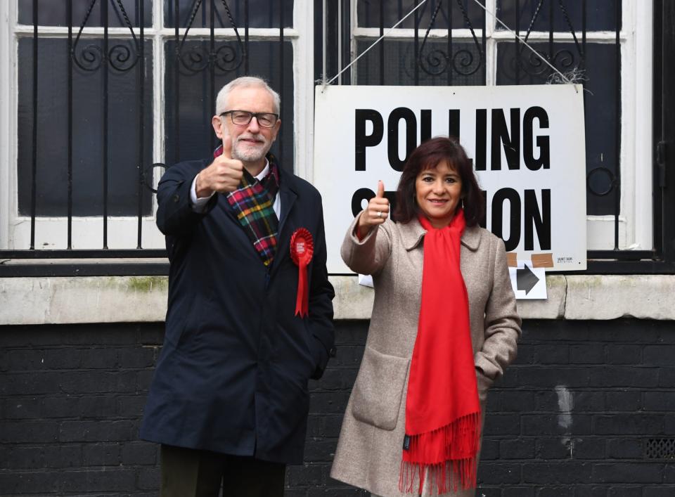 Jeremy Corbyn and his wife Laura Alvarez on polling day (PA)