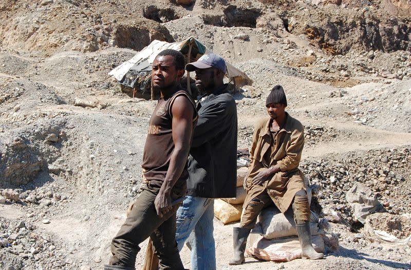 FILE PHOTO: Artisanal miners work at the Tilwizembe, a former industrial copper-cobalt mine, outside of Kolwezi, the capital city of Lualaba Province in the south of the Democratic Republic of the Congo