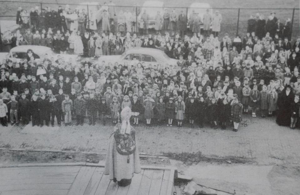 Catholic Diocese of Belleville Bishop Albert Zuroweste addresses students at a ceremony to lay the cornerstone for the new Cathedral Grade School building, which opened in 1958.