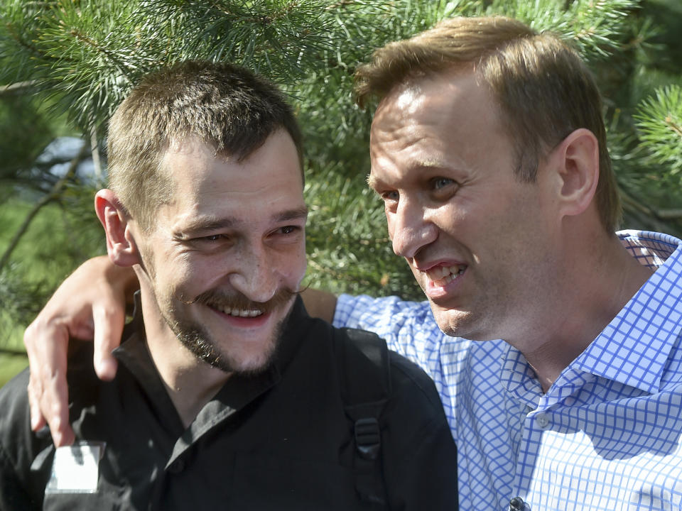 FILE - In this June 29, 2018, file photo, Russian opposition leader Alexei Navalny, right, embraces his brother, Oleg Navalny, center, after Oleg was released from prison in Naryshkino, Russia. Attempts over the years to stop the political work of Alexei Navalny have failed so far. Oleg Navalny was jailed for over three years on fraud charges. (AP Photo/Dmitry Serebryakov, File)