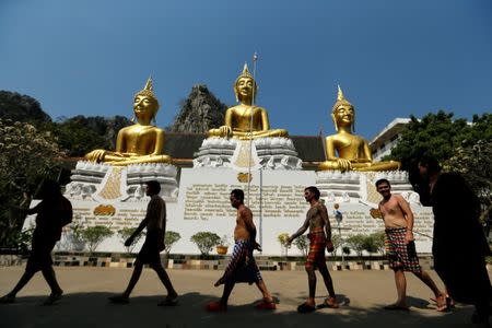 Patients walk to take a steam bath at the rehabilitation and detox area at Wat Thamkrabok monastery in Saraburi province, Thailand, February 8, 2017. REUTERS/Jorge Silva