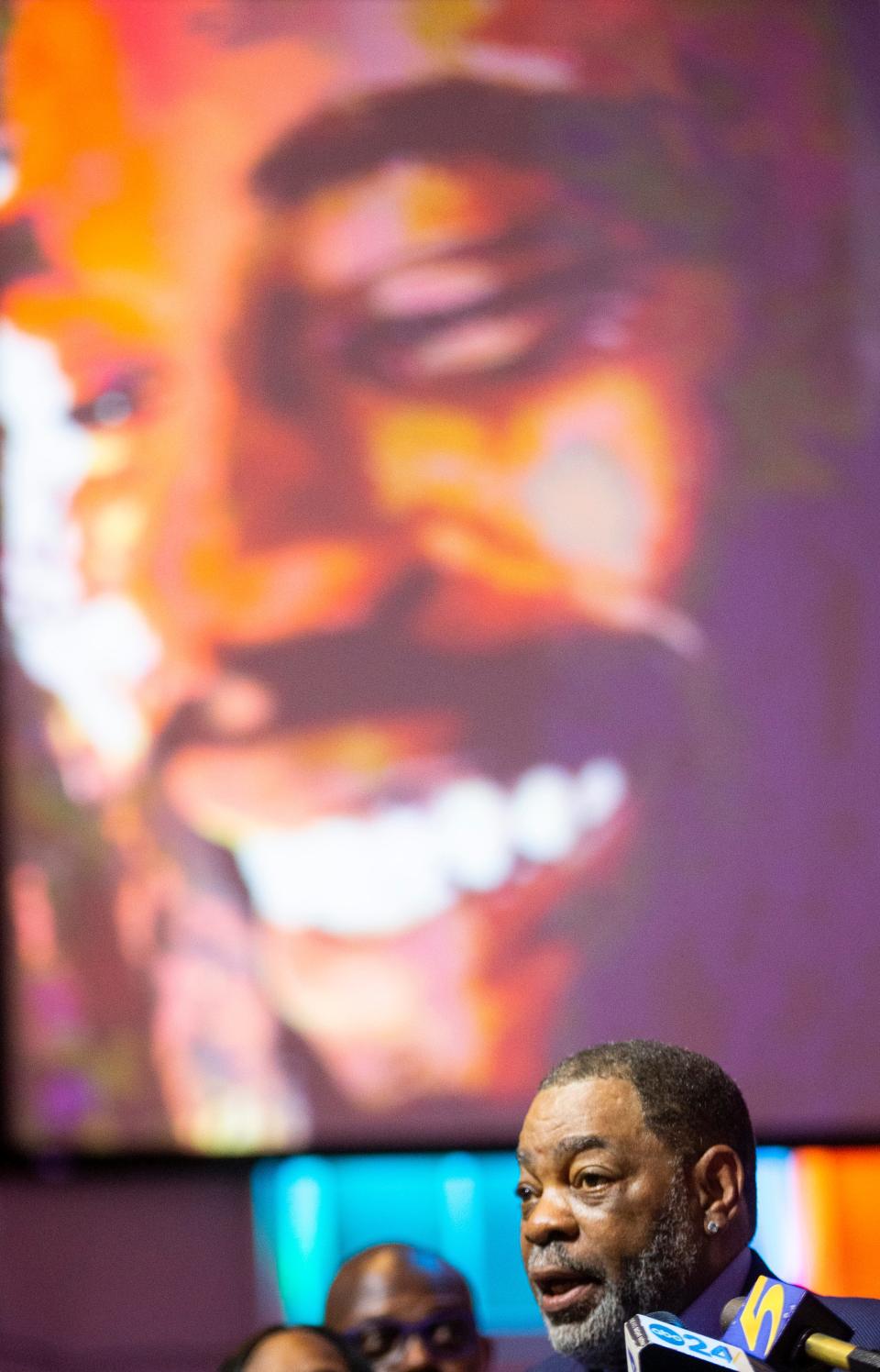 Rodney Wells, the father of Tyre Nichols, speaks during a press conference held by civil rights attorney Ben Crump as a photo of his son looks down on him after the Department of Justice announced that an indictment is pending in federal court for the five now-former Memphis police officers involved in the Tyre Nichols case at Mississippi Boulevard Baptist Church in Memphis, Tenn., on Tuesday, September 12, 2023.