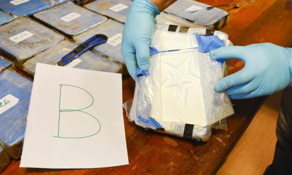 Police work during an operation that led to the seizure of hundreds of pounds of cocaine from the Russian embassy in Buenos Aires.