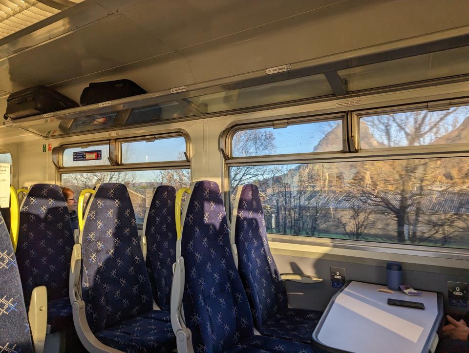 interior of scotsrail train from glasgow to oban, seats with tray in front of them