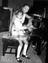 <p>Nina's daughter, Lisa, accompanies her to the recording studio in England in May 1968, where she played the piano while her mother recorded <em>T</em><em>he</em> <em>Sound of Soul</em>. </p>