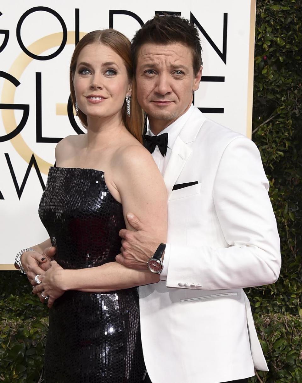 Amy Adams, left, and Jeremy Renner arrive at the 74th annual Golden Globe Awards at the Beverly Hilton Hotel on Sunday, Jan. 8, 2017, in Beverly Hills, Calif. (Photo by Jordan Strauss/Invision/AP)