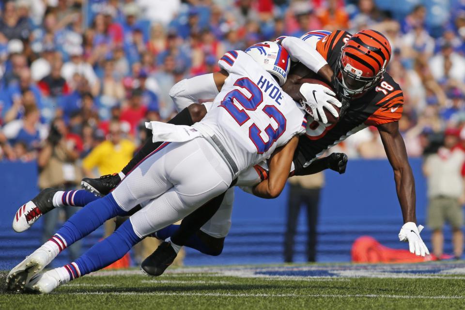 Cincinnati Bengals wide receiver A.J. Green (18) is tackled by Buffalo Bills' Micah Hyde (23) during the first half of a preseason NFL football game Sunday, Aug. 26, 2018, in Orchard Park, N.Y. (AP Photo/Jeffrey T. Barnes)