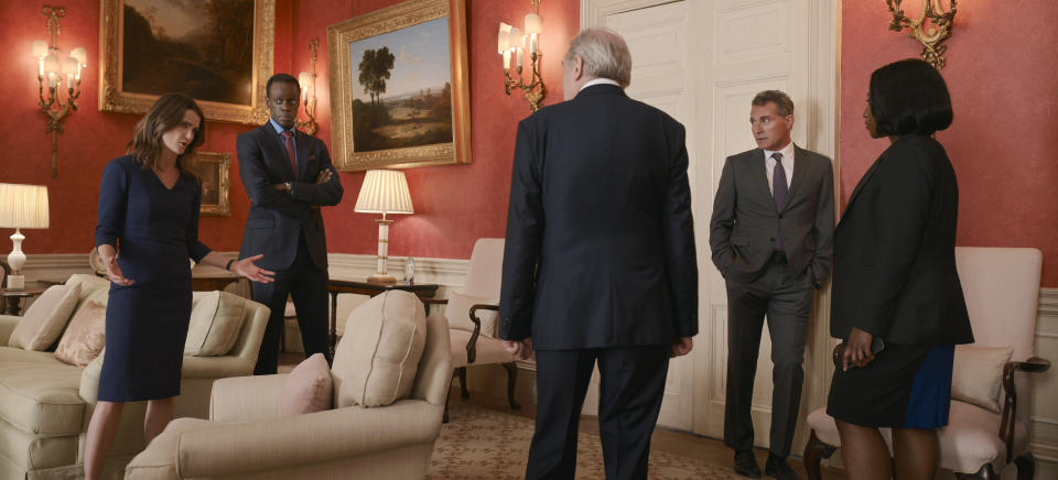 This image released by Netflix shows, from left, Keri Russell as Kate Wyler, Ato Essandoh as Stuart Heyford, Michael McKean as William Rayburn, Rufus Sewell as Hal Wyler, Nana Mensah as Billie Appiah, in a scene from "The Diplomat." (Netflix via AP)