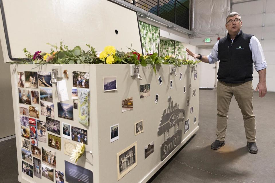 Return Home CEO Micah Truman shows a demonstration "vessel" for the deceased, that has been decorated with flowers, family photos and sports-team logo by Return Home, during a tour of the funeral home which specializes in human composting in Auburn, Washington on March 14, 2022. - Washington in 2019 became the first in the United States to make it a legal alternative to cremation. (Photo by Jason Redmond / AFP) (Photo by JASON REDMOND/AFP via Getty Images)