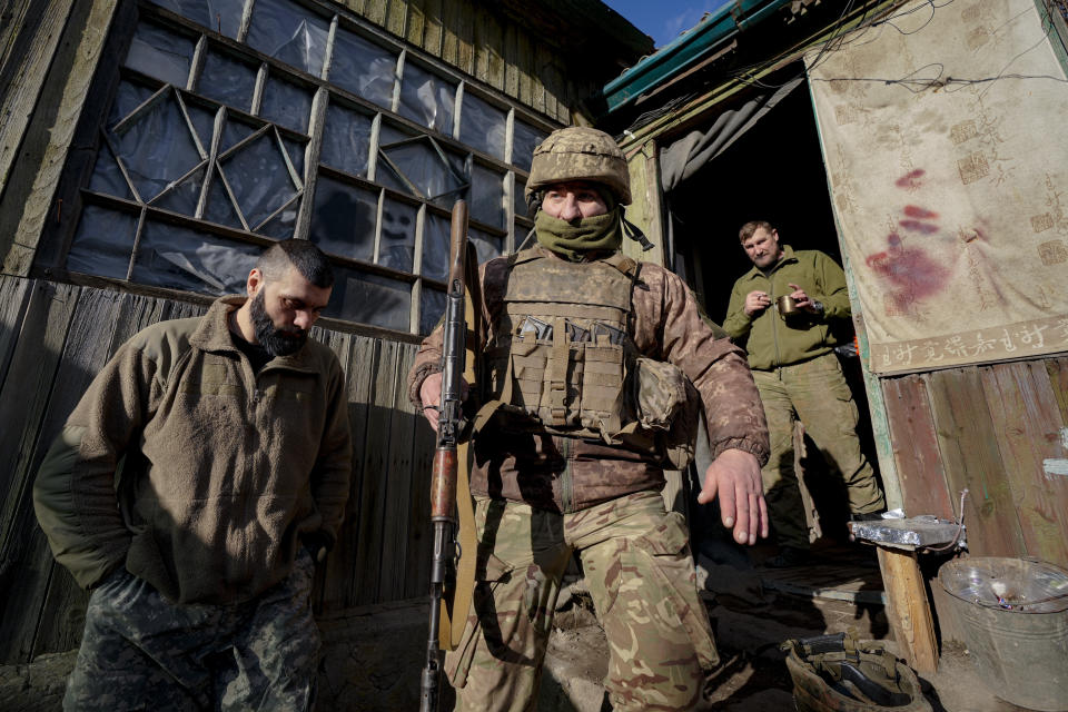 A Ukrainian serviceman leaves a coomand post to start his shift at a frontline position outside Popasna, in the Luhansk region, eastern Ukraine, Sunday, Feb. 20, 2022. Russia extended military drills near Ukraine's northern borders Sunday amid increased fears that two days of sustained shelling along the contact line between soldiers and Russia-backed separatists in eastern Ukraine could spark an invasion. Ukraine's president appealed for a cease-fire. (AP Photo/Vadim Ghirda)