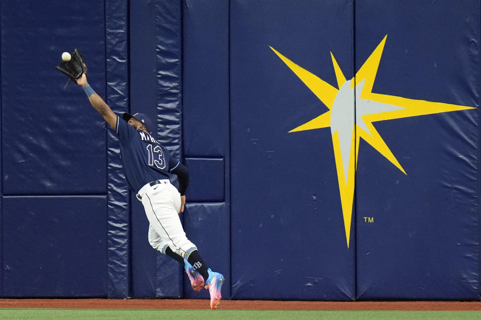 Tampa Bay Rays center fielder Manuel Margot makes a running catch on a fly out by Los Angeles Angels' Logan O'Hoppe during the sixth inning of a baseball game Tuesday, Sept. 19, 2023, in St. Petersburg, Fla. (AP Photo/Chris O'Meara)