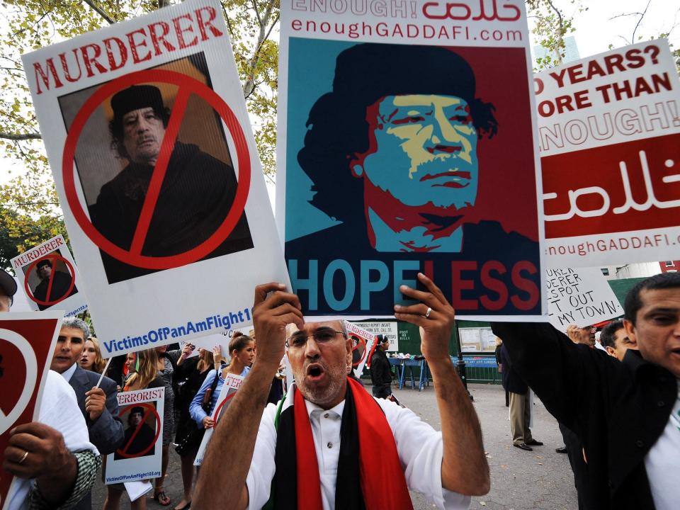 Protesters shout slogans against Libyan leader Muammar al-Gaddafi