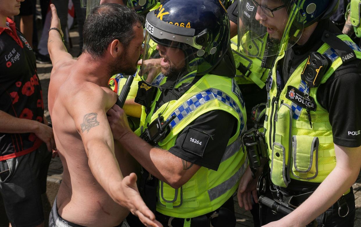 Police clash with right wing protesters in Piccadilly Gardens