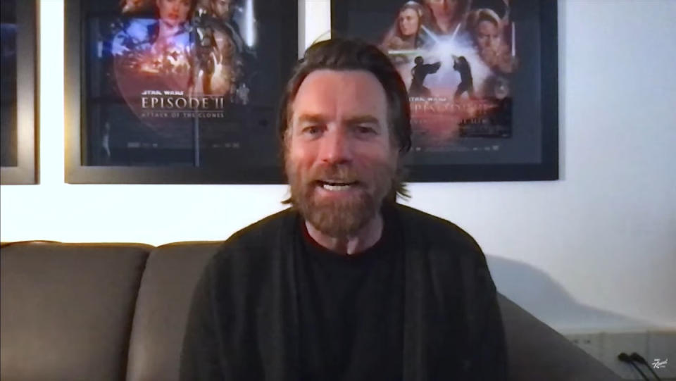 Ewan McGregor talking in front of Star Wars posters