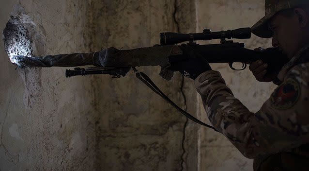 A sniper aims towards Islamic State positions near Mosul, Iraq. Source: AP Images