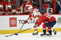 Calgary Flames right wing Brett Ritchie (24) skates with the puck against Washington Capitals during the second period of an NHL hockey game, Saturday, Oct. 23, 2021, in Washington. (AP Photo/Nick Wass)