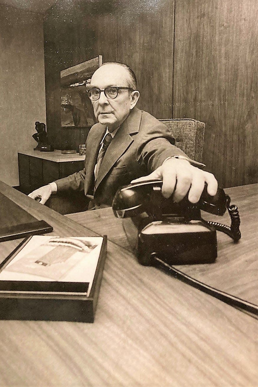 Russell Blanchard, Georgia Railroad Bank president, reaches for the phone in a photo from 1972.