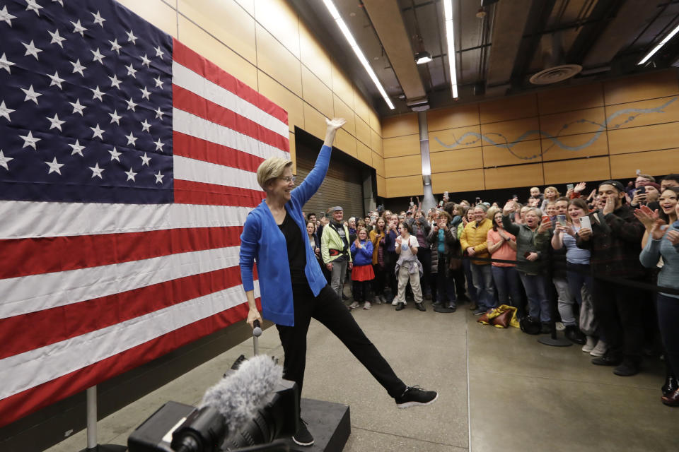 FILE - In this Feb. 22, 2020, file photo, Democratic presidential candidate U.S. Sen. Elizabeth Warren, D-Mass., addresses an overflow crowd before addressing a larger rally during a campaign event in Seattle. Cherokee citizens are calling on Warren to publicly disavow a family story of indigenous heritage as a way to dissuade others from making false claims they say often romanticize Native Americans. The topic has haunted the Massachusetts senator since even before she announced she would seek the Democratic nomination for president, despite Warren repeatedly apologizing for identifying as Native American in the past and for submitting a DNA test to back up what she heard growing up. (AP Photo/Elaine Thompson, File)