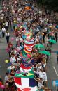 <p>Protesters walk with hundreds of flags of the countries of the world during the “Hamburg zeigt Haltung” (Hamburg shows dignity) demonstration on July 8, 2017 in Hamburg, northern Germany as world leaders meet during the G20 summit. (Photo: Odd Andersen/AFP/Getty Images) </p>