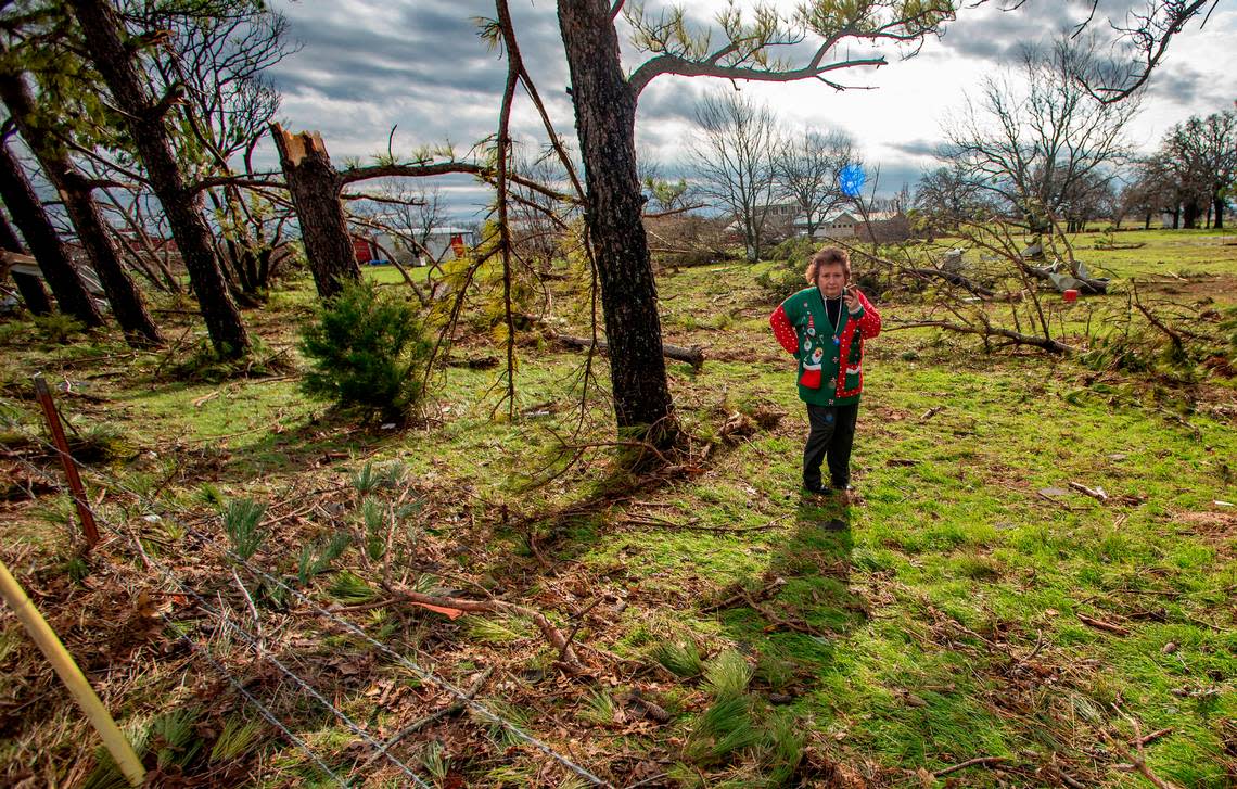 Amy Pegues checks on her sister’s ranch across FM 730 from a home that was destroyed by the twister. A tornado touched down just south of Decatur, Texas, along FM 730 early morning Tuesday, Dec. 13, 2022, tearing the roof off of a home and ripping trees in half. Debris was strewn across the highway.