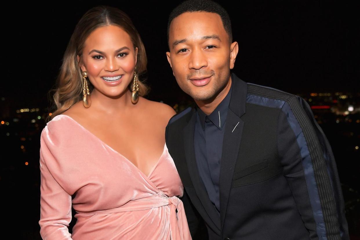 Having a laugh: Chrissy Teigen and John Legend: Getty Images for GQ