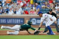 Jun 6, 2018; Arlington, TX, USA; Texas Rangers first baseman Ronald Guzman (67) misses the catch on a ball thrown on a pick of attempt of Oakland Athletics center fielder Dustin Fowler (11) in the third inning at Globe Life Park in Arlington. Mandatory Credit: Tim Heitman-USA TODAY Sports