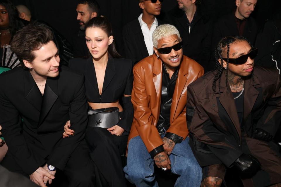 Brooklyn and Nicola Peltz-Beckham with Alexander Edwards and Tyga at the Mugler AW24 show (Vianney Le Caer/Invision/AP)