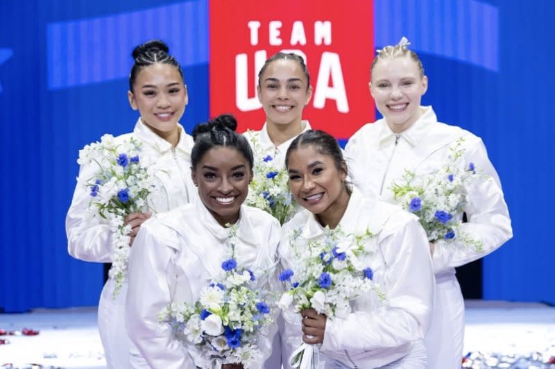 The United States women's gymnastics team for Paris 2024, including (from left to right), Suni Lee, Simone Biles, Hezly Rivera, Jordan Chiles and Jade Carey, poses at the Olympic trials Sunday at Target Center in Minneapolis. Photo by John Cheng/USA Gymnastics