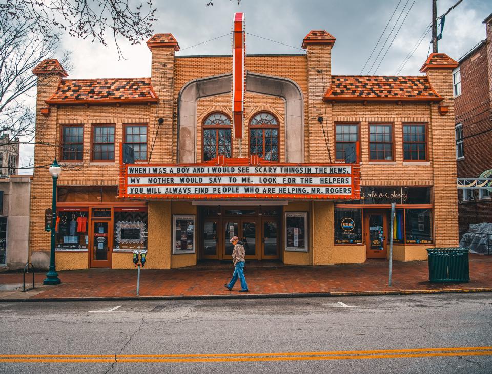 A man walks past the Buskirk-Chumley Theater on Kirkwood Avenue Friday, March 20, 2020.