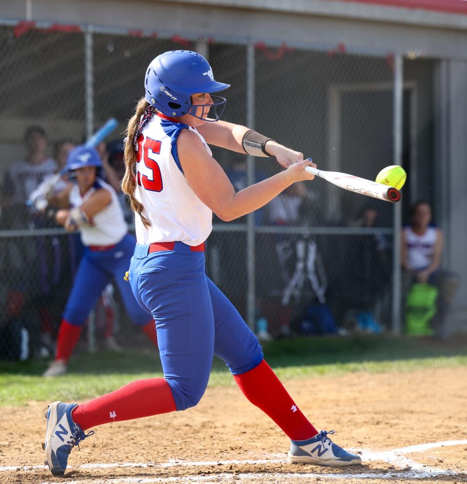 Tuslaw's Meridith Rankl blast a first inning three-run homer for the early 3-0 lead in Div. III District final action in Creston.