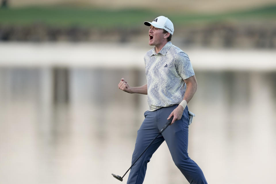 Nick Dunlap reacts after making his putt on the 18th hole of the Pete Dye Stadium Course during the final round to win the American Express golf tournament, Sunday, Jan. 21, 2024, in La Quinta, Calif. (AP Photo/Ryan Sun)