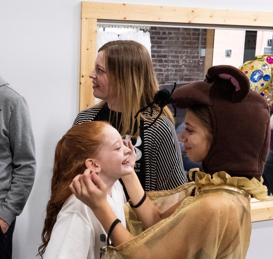 Lilly Rehs pokes at Aspen Baird during a rehearsal for "The Nutcracker." The 28th annual show opened Friday at The Midland Theatre in Newark.