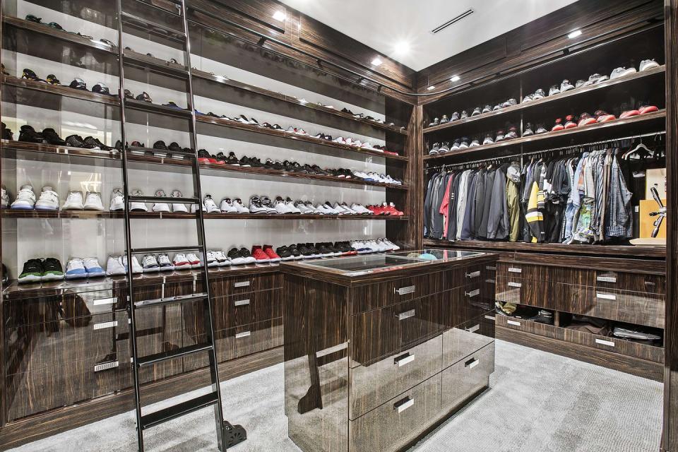 The master suite includes a walk-in wardrobe with room for a wall of shoes and trainers