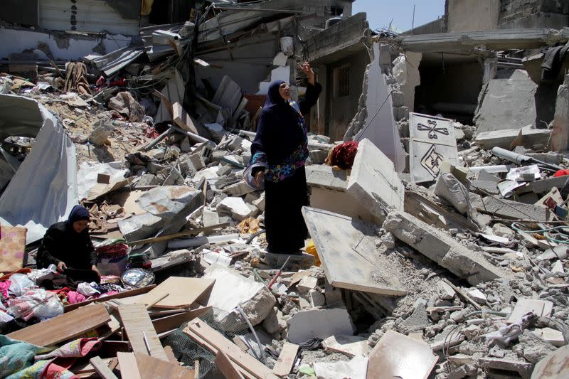 Palestinians inspect the damage after Israeli forces withdrew from Jabalia refugee camp