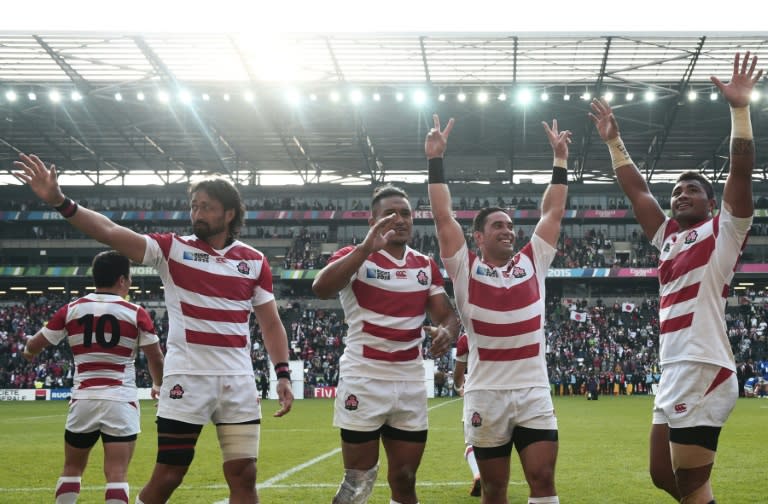 Japan celebrate after winning their Pool B match in the 2015 Rugby World Cup against Samoa at Stadium MK, on October 3, 2015