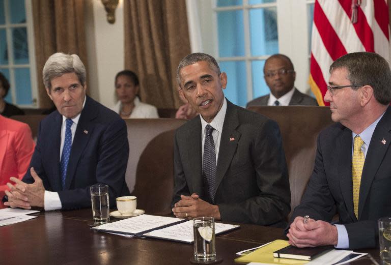 US President Barack Obama speaks during a Cabinet meeting at the White House in Washington, DC, on May 21, 2015 as Secretary of State John Kerry (L) and Defense Secretary Ashton Carter (R) look on