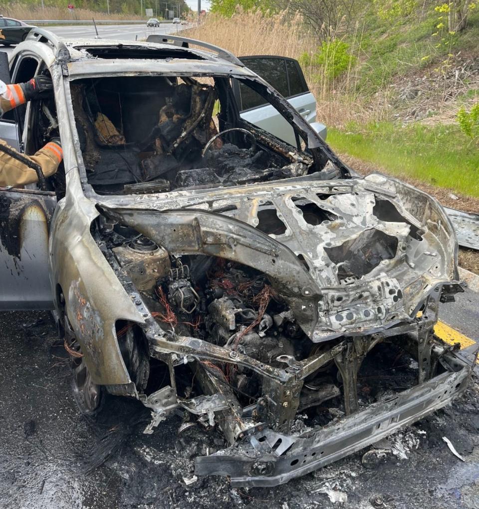 Maggie Marchand, 18, was driving on Route 101 Tuesday when an explosion under her car's hood caused the vehicle to be engulfed with smoke and growing flames. She pulled over and escaped despite her brakes having failed.