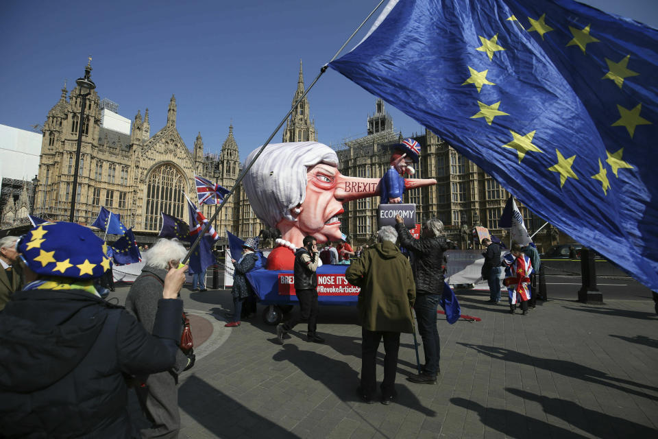 Anti-Brexit demonstrators near College Green at the Houses of Parliament in London, Monday, April 1, 2019. Britain's Parliament gets another chance Monday to offer a way forward on Britain's stalled divorce from the European Union, holding a series of votes on Brexit alternatives in an attempt to find the elusive idea that can command a majority. (Jonathan Brady/PA via AP)