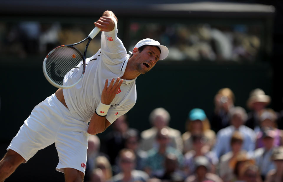 Serbia's Novak Djokovic in action against Great Britain's Andy Murray on day thirteen of the Wimbledon Championships at The All England Lawn Tennis and Croquet Club, Wimbledon.