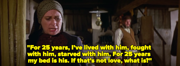 A woman singing "For 25 years, I’ve lived with him, fought with him, starved with him. For 25 years my bed is his. If that’s not love, what is?"