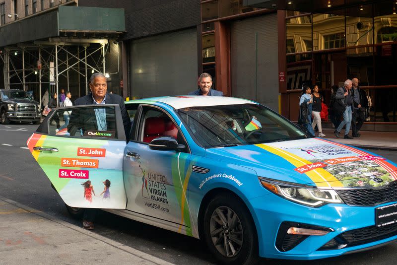 FILE PHOTO: A rideshare car with ads wrapped by mobile advertisement company Carvertise, in New York City