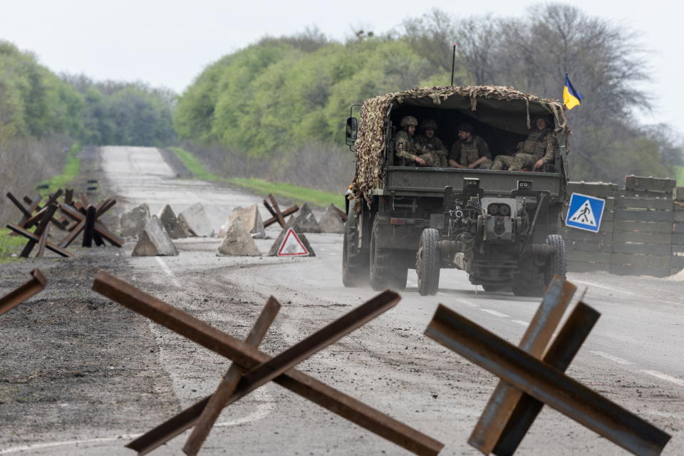 A Ukrainian military vehicle drives to the front line during a fight, amid Russia's invasion in Ukraine, near Izyum, Donetsk region, Ukraine, April 23, 2022. REUTERS/Jorge Silva