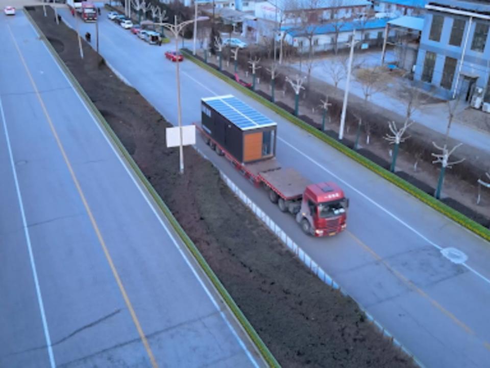 A truck delivering Nestron's tiny home