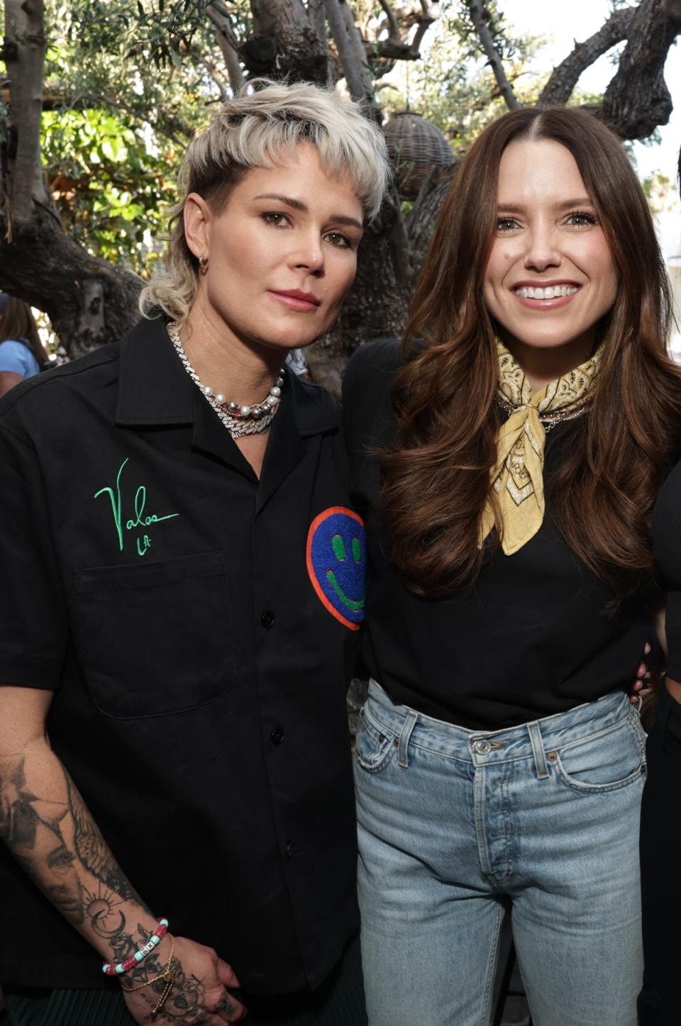 Ashlyn Harris and Sophia Bush posing together at an event