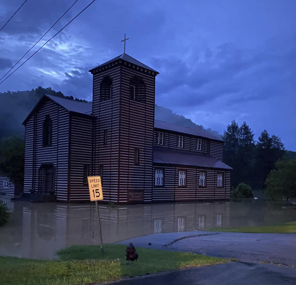This image provided by Marlene Abner Stokely shows flooding by the Buckhorn Log Cathedral, Thursday, July 28, 2022 in Buckhorn, Ky. Heavy rains have caused flash flooding and mudslides as storms pound parts of central Appalachia. Kentucky Gov. Andy Beshear says it's some of the worst flooding in state history. (Marlene Abner Stokely via AP)