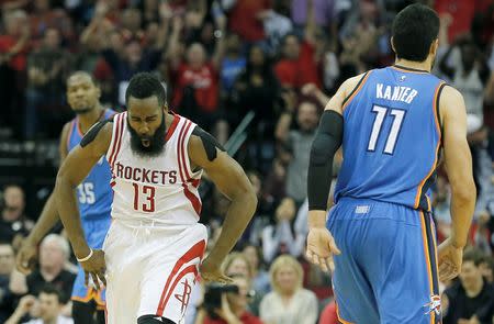 Nov 2, 2015; Houston, TX, USA; Houston Rockets guard James Harden (13) reacts after making a three point basket against the Oklahoma City Thunder in the fourth quarter at Toyota Center. Rocket won 110 to 105. Mandatory Credit: Thomas B. Shea-USA TODAY Sports