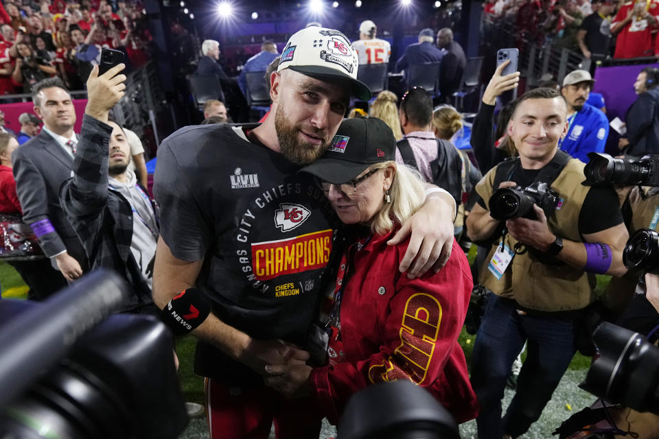 Kansas City Chiefs tight end Travis Kelce (87) hugs his mother Donna, after the NFL Super Bowl 57 football game, Sunday, Feb. 12, 2023, in Glendale, Ariz. The Chiefs defeated the Philadelphia Eagles 38-35. (AP Photo/Matt Slocum)