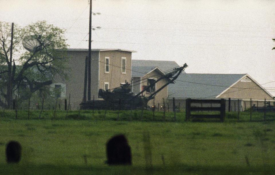 A battering ram on an armored vehicle ripped holes in the walls of the Branch Davidian compound.