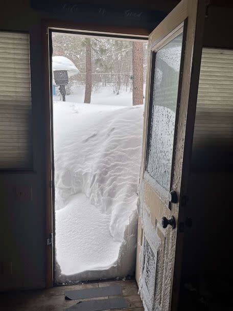 PHOTO: David and Kelli Góra's home is covered after a snowstorm in Big Bear Lake, Calif., March 1, 2023. (David Góra/AP)